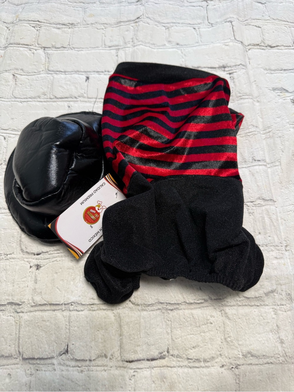 Pet Warrior Dog striped red and white shirt and black pants custome. Halloween c